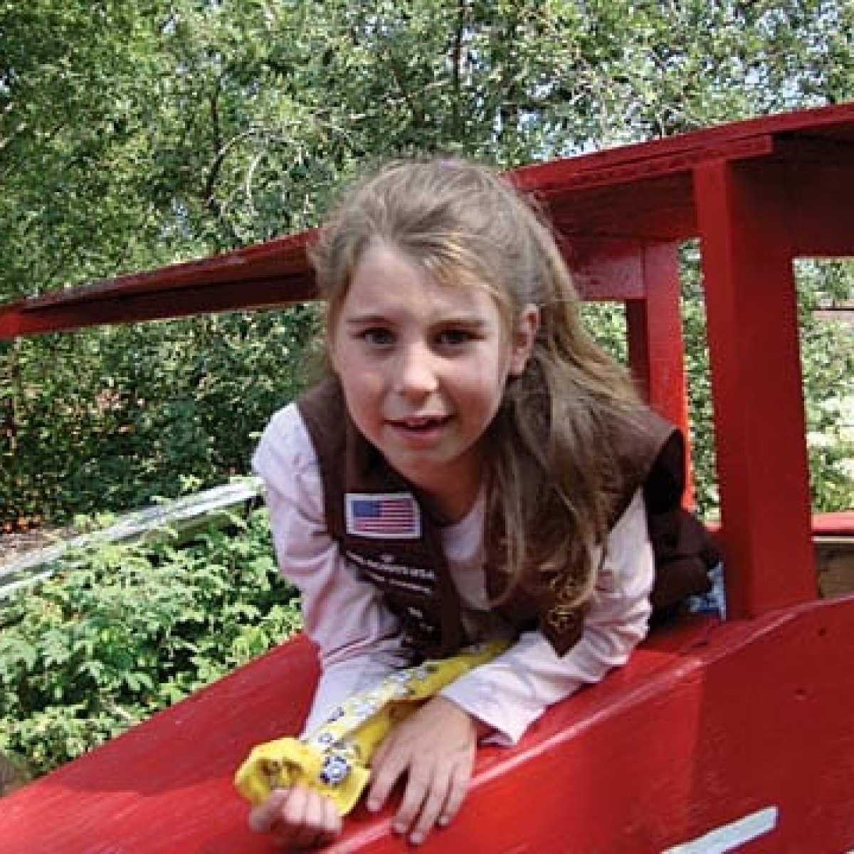 a girl sitting on a table