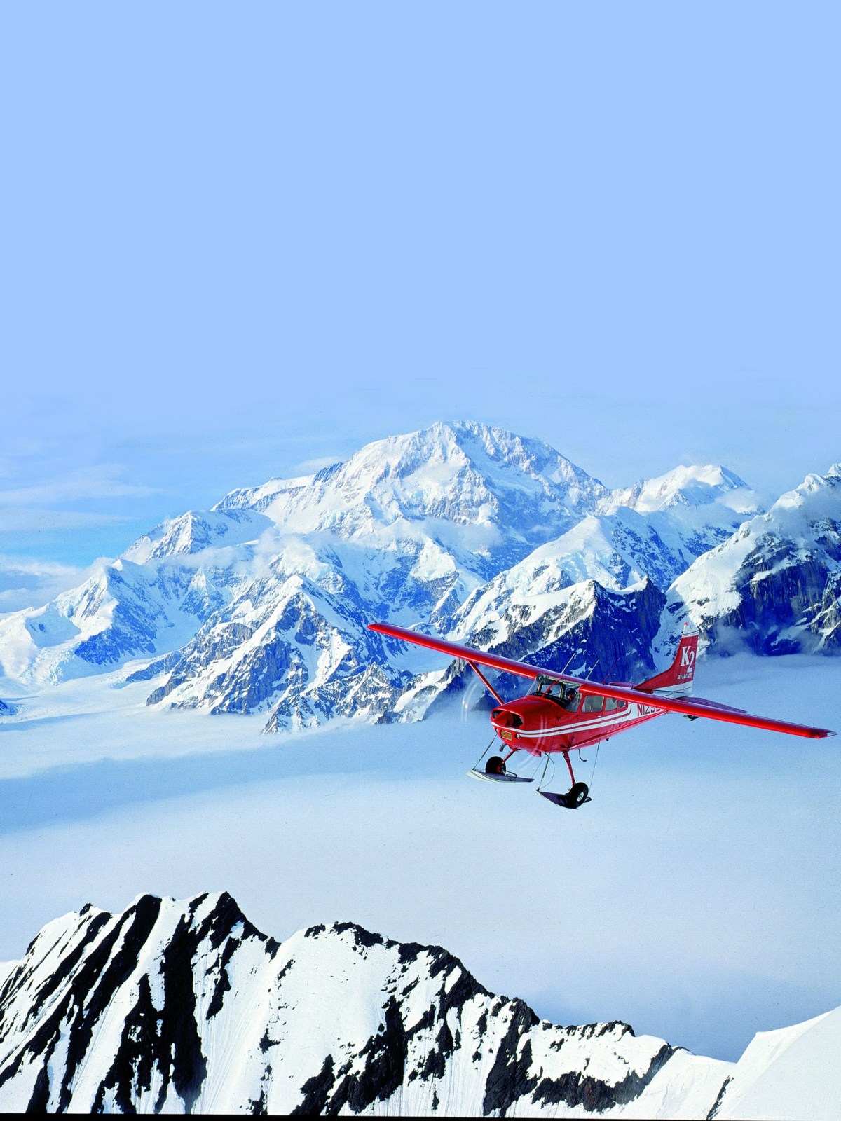 275671503_10160146010763140_3655119773794084198_n a man riding skis down a snow covered mountain