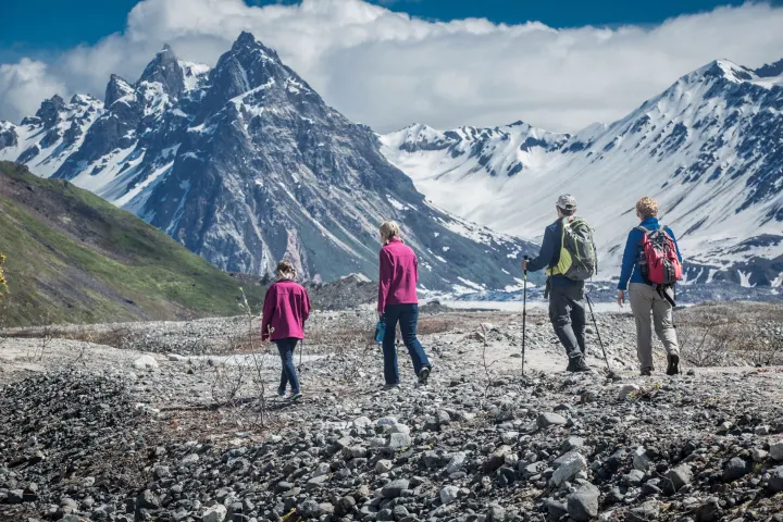 a group of people standing on top of a mountain