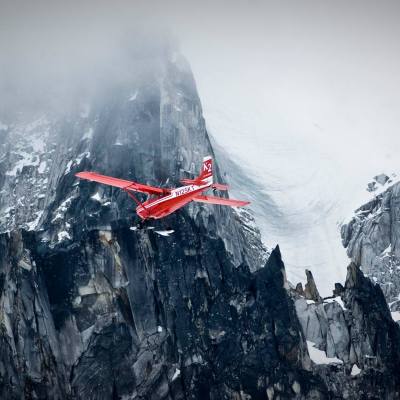 a person riding skis down a snow covered mountain