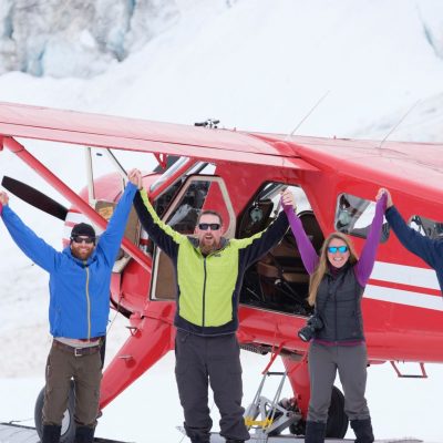 a group of people posing for a picture in the snow
