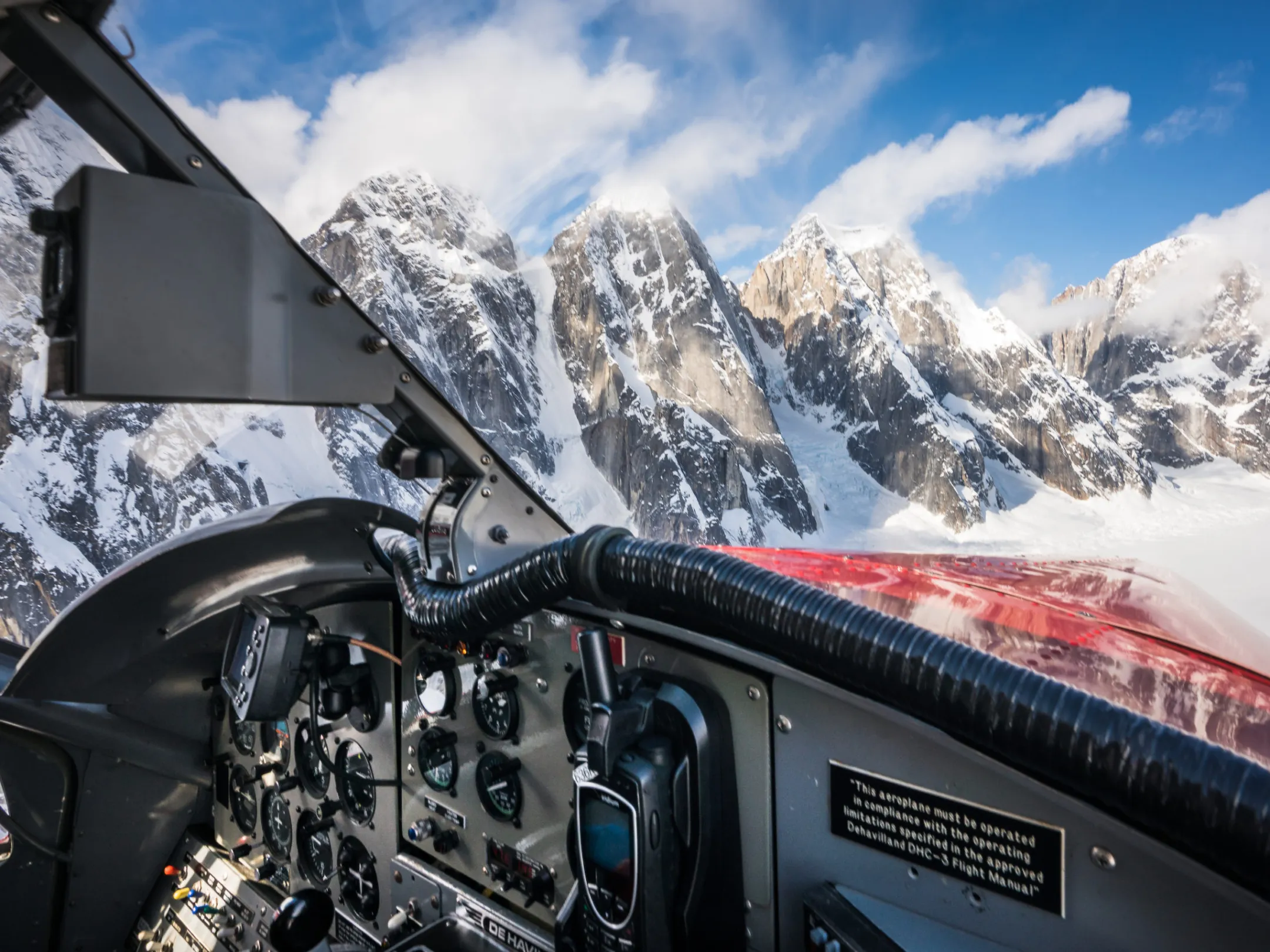a view of mountains outside a plane