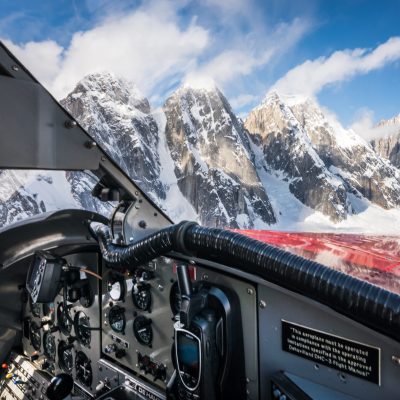 a view of mountains outside a plane
