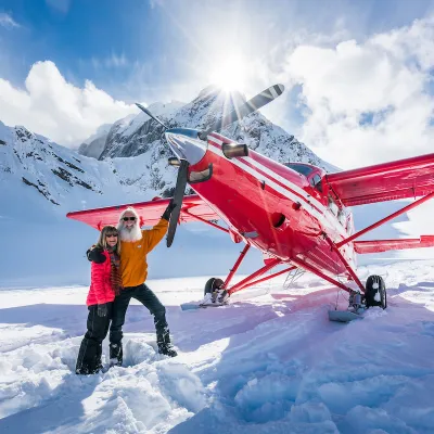 a person standing on top of a snow covered slope