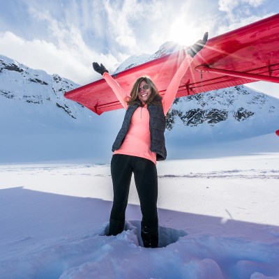 a person standing on a snow covered slope