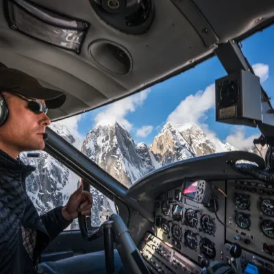 a man standing in front of a car