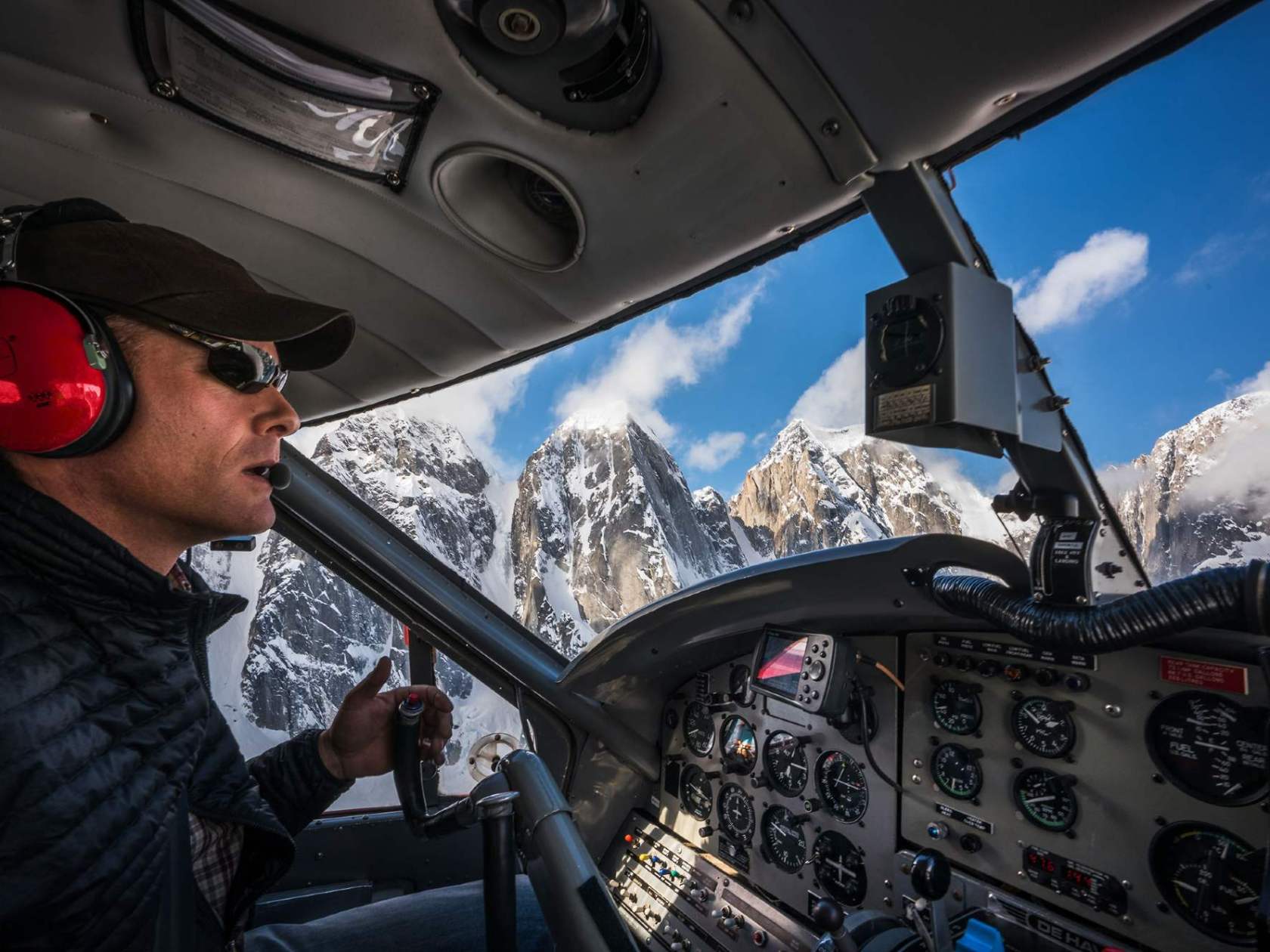 a man standing in front of a car