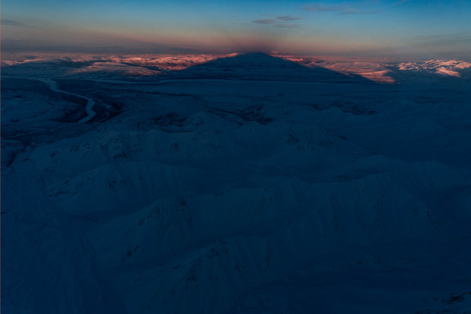 Denali cast's a 50 miles shadow in the winter flightseeing on K2 Aviation's Denali Grand Tour