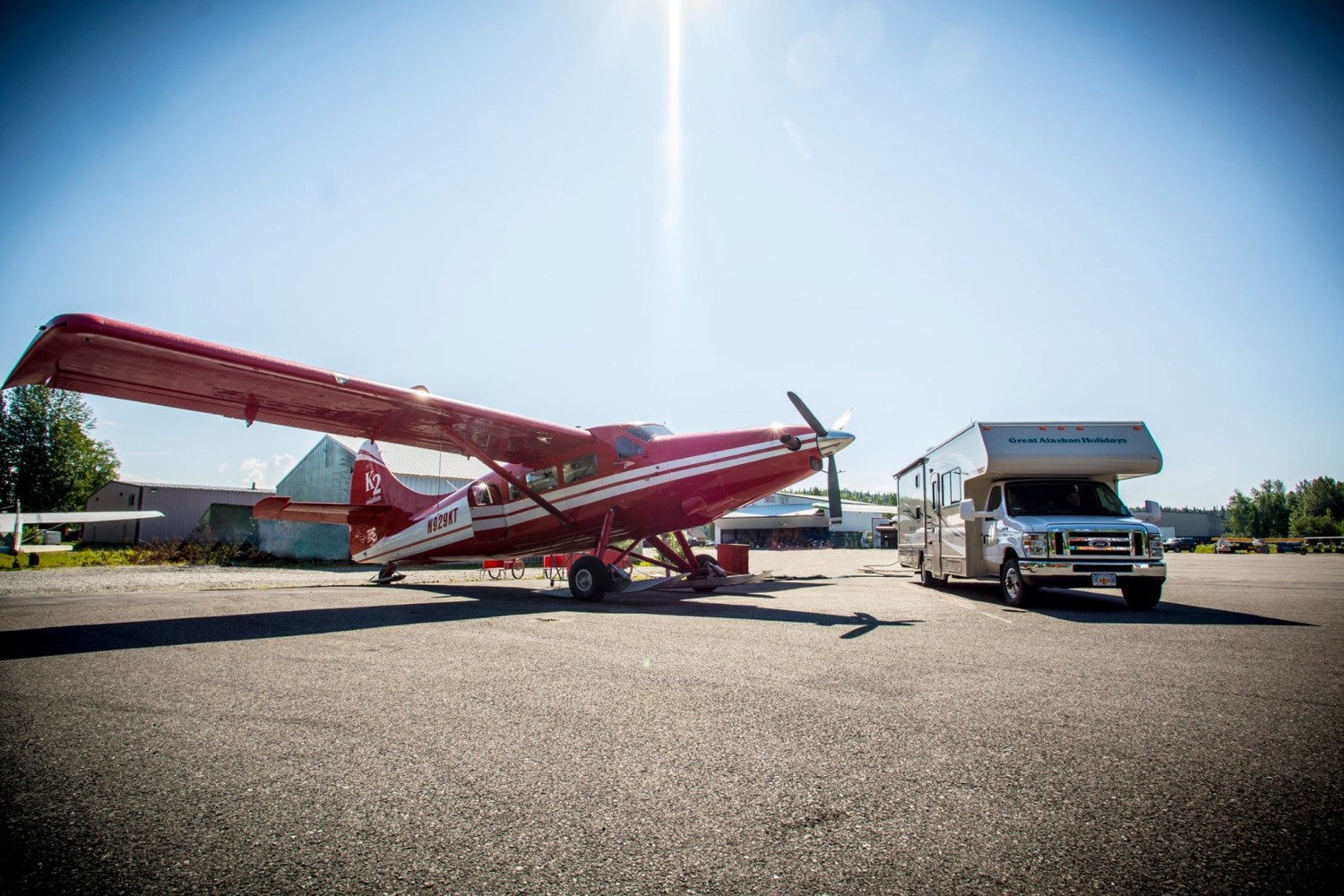 a Great Alaska Holiday Rv parked next to a K2 Aviation de Havilland Otter