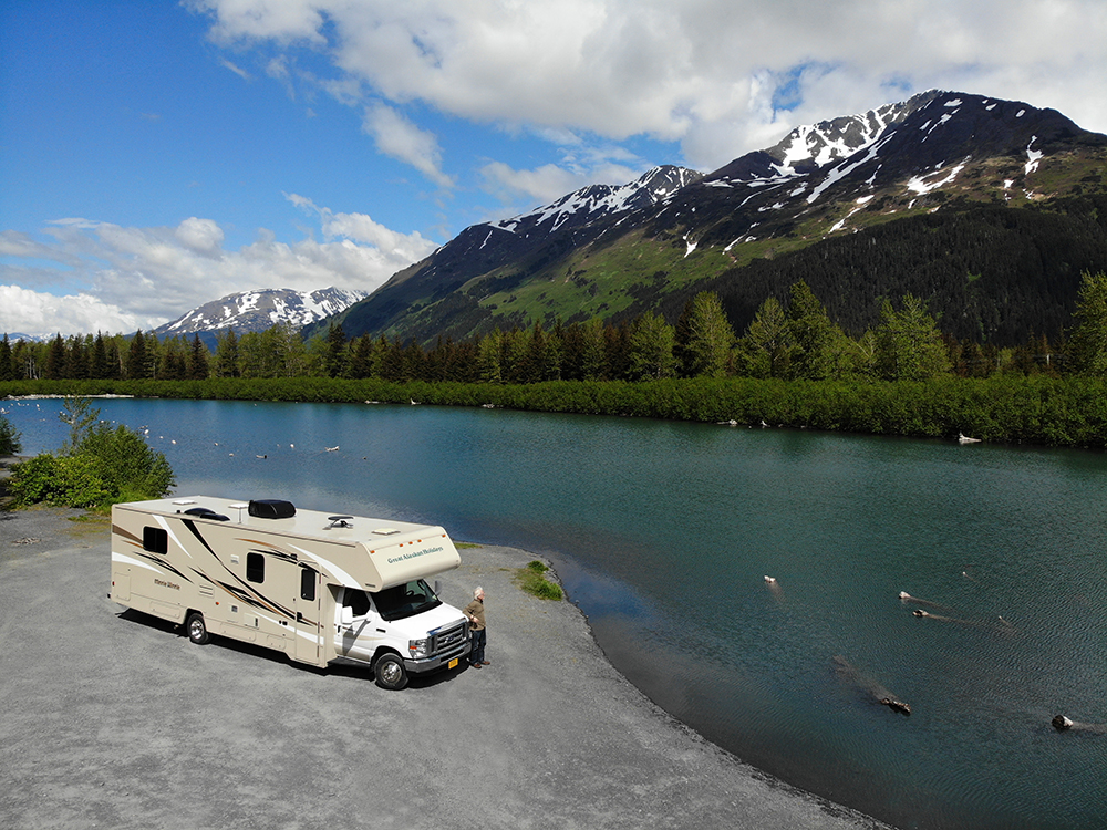 Great Alaskan Holiday Rv parked on the side of a mountain with lake