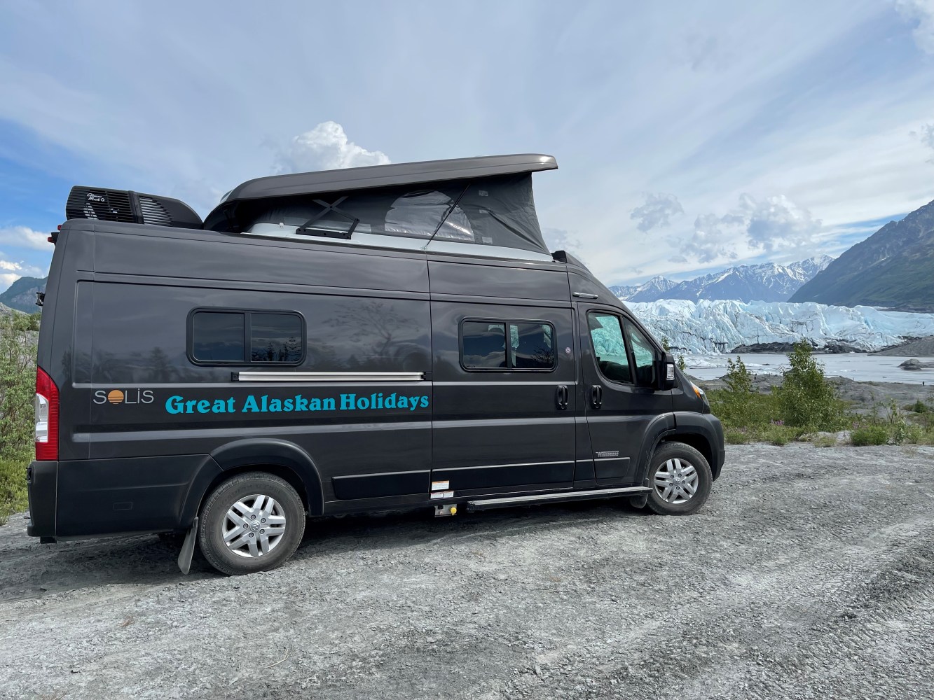 A Great Alaskan Holiday Rv parked on the side of a mountain with glacier