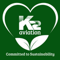 K2 Aviation logo with heart, leaves, and text: Committed to Sustainability.